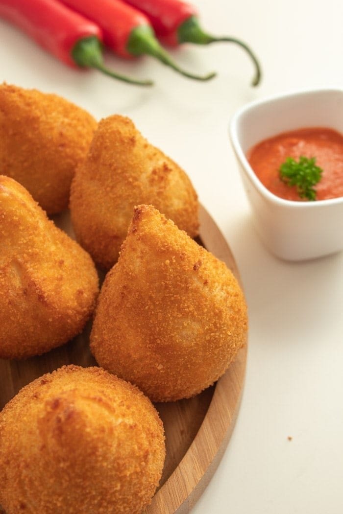 Golden Brazilian croquettes with dipping sauce